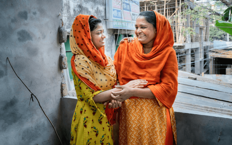 Dhaka, Bangladesh: Kakoli* and Sabina* work in a garment factory and barely earn enough to meet their basic needs. Oxfam’s What She Makes campaign demands that big brands pay the women who make our clothes a living wage. Photo: Fabeha Monir/Oxfam. *Names changed to protect identity.