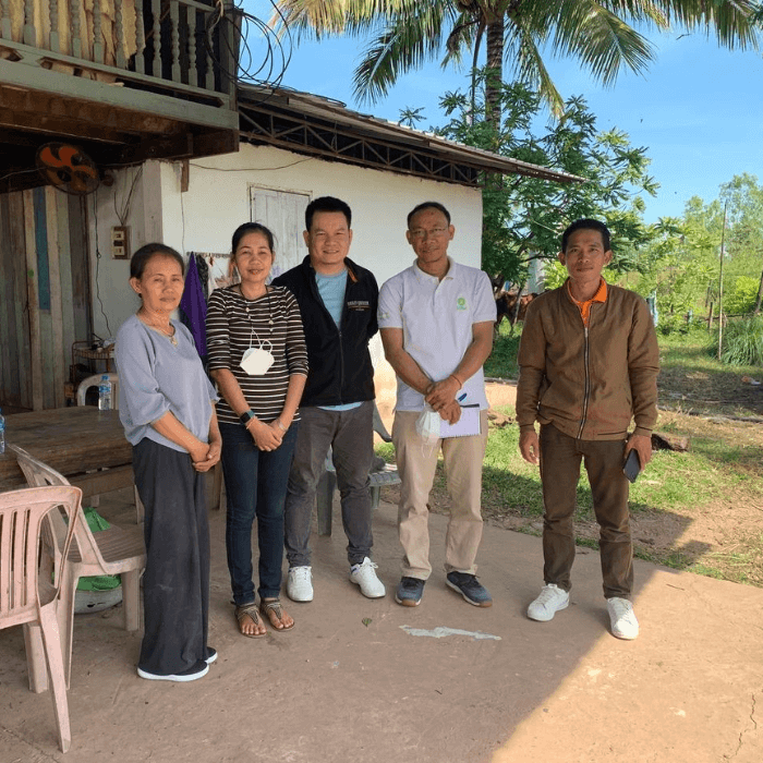Champasak province, Laos: Oxfam visits community users of biogas, from left: Ms Bounheaung (biogas user), Ms Odeth (Champasak University), Dr Vannanish (Champasak University), Mr Saneth Meas (Oxfam), Mr Salongxay (Champasak University). Photo: Mr Sengsulixay.