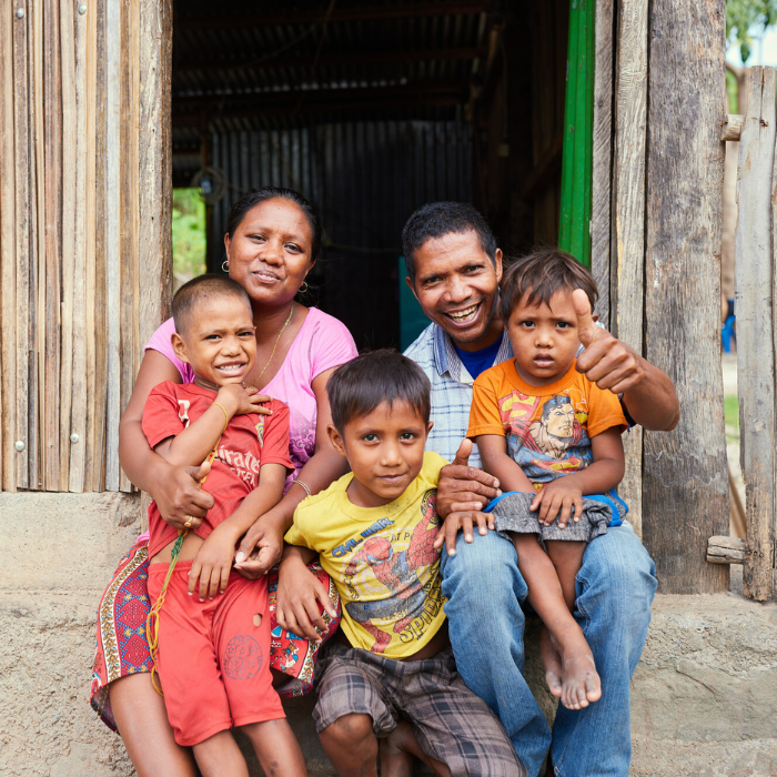 Likisa, Timor-Leste: Ilda and her husband, Angelino, with their children. Ilda was always a saver, even before joining the ROMANSA savings group. She is currently a leader in her group. Photo: Patrick Moran/Oxfam. Oxfam acknowledges the support of the Australian Government through the Australian NGO Cooperation Program (ANCP).