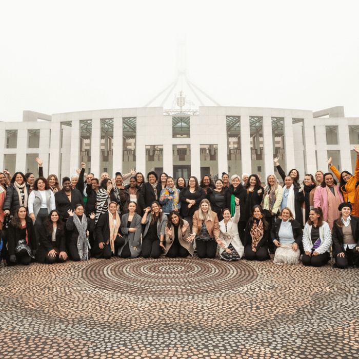 Canberra, Australia: Straight Talk delegates and facilitators pictured in front of the Australian Parliament House during the August 2022 Straight Talk National Summit. Photo: Jillian Mundy/Oxfam.
