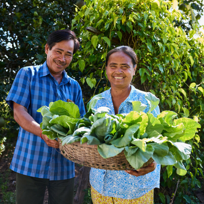 Cambodia: Chana and Sare (both 50s) are part of an Aquaponics pilot project in their village. The pilot gives local villagers the opportunity to grow vegetables in a climate resilient way that can then be used to support their household expenses. Photo: Patrick Moran/Oxfam. Oxfam acknowledges the support of the Australian Government through the Department of Foreign Affairs and Trade (DFAT).